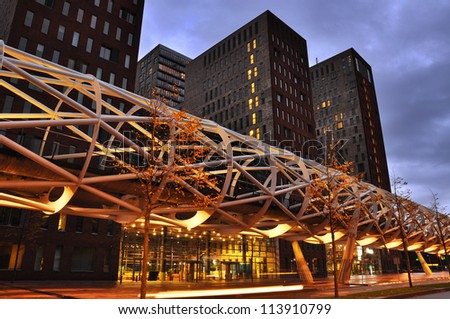 The Hague, The Netherlands, a modern tram viaduct calling: The 'Netkous' or Fishnet Stocking, in The Beatrixkwartier, a modern financial district in Den Haag, Holland