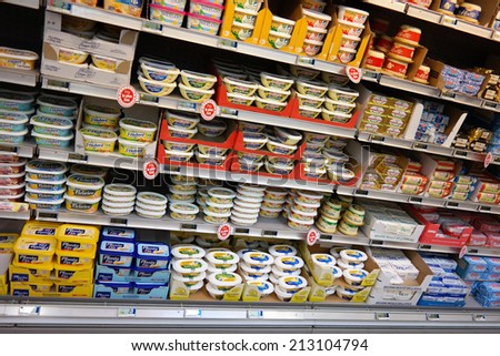 NORMANDY, FRANCE - JULY 23: Refrigerated shelves of butter and margarine at a Carrefour Hypermarket, European dairy products are blocked by a trade embargo by Russia, on July 23, 2014 Normandy, France