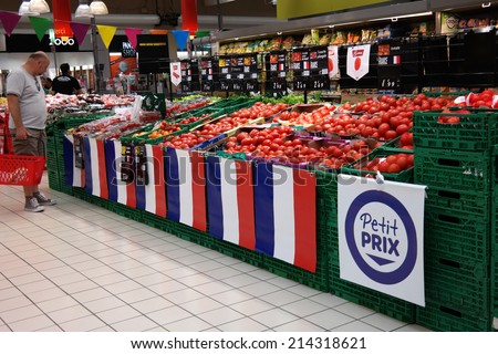 SAINT-LO, FRANCE - JULY 23: Attention for french products in a Carrefour hypermarket. Carrefour is a French retailer, and a large supermarket chain worldwide on July 23, 2014 in Normandy, France