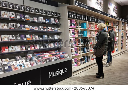 MALMEDY, BELGIUM - MAY 2015: Customers in the media section in a Carrefour Hypermarket