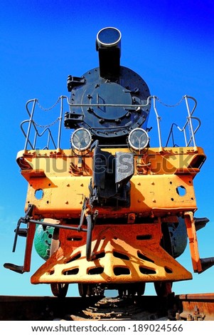 iron locomotive on the rails, steel machine, trucks, wheels.