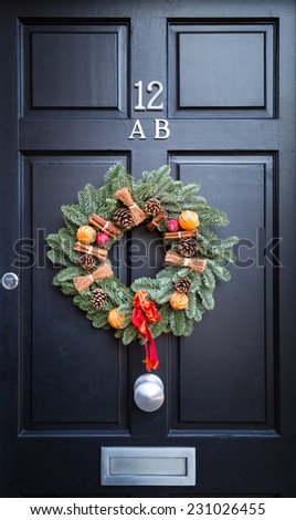 Christmas wreath hanging on elegant front door