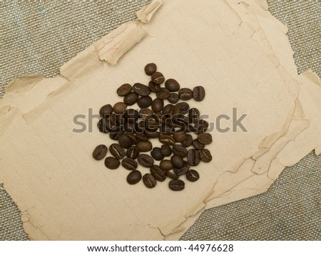 coffee beans scattered on the old paper