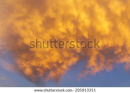 Abstract colorful orange sunset with cloudy sky and dramatic light