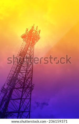 Telecommunications tower mobile phone base station in soft color background