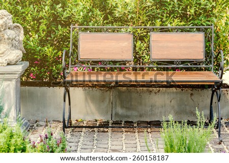 Wood bench decorate in beautiful flower garden