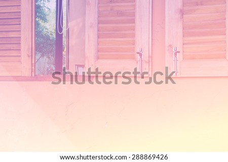 Opened wood window on the old grunge yellow background - Color filter effect style pictures