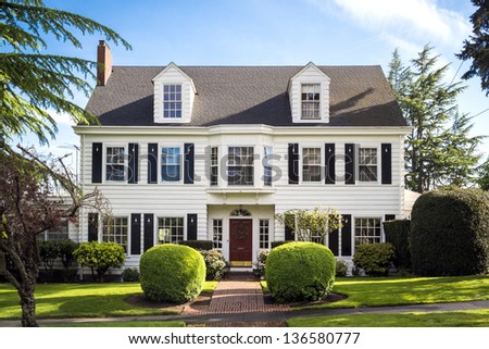 Classic American suburban house with blue sky background