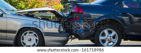 Auto accident involving two cars on a city street
