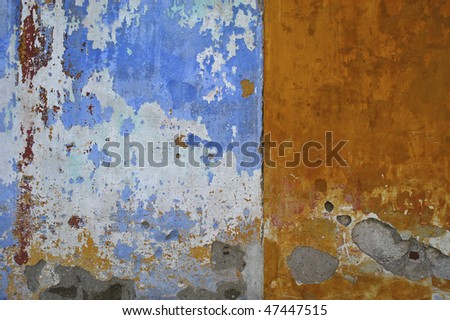 Wall painted with old blue and orange paint