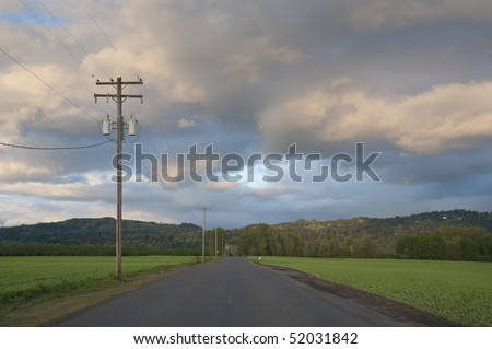 Rural highway under scattered clouds, Willamette Valley, Oregon