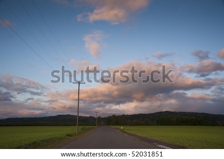 Rural highway under sunset clouds, Willamette Valley, Oregon