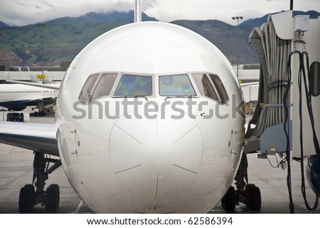 Commercial jet airplane parked at loading gate