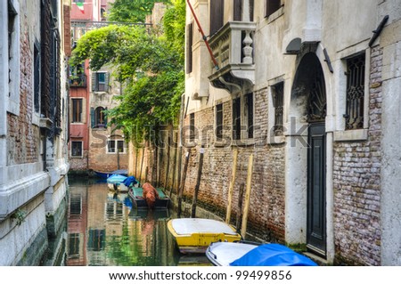 Canal reflections and old buildings in Venice, Italy