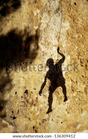 Sport Rock climber in the shadow