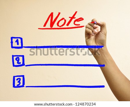 Male hand writing note list