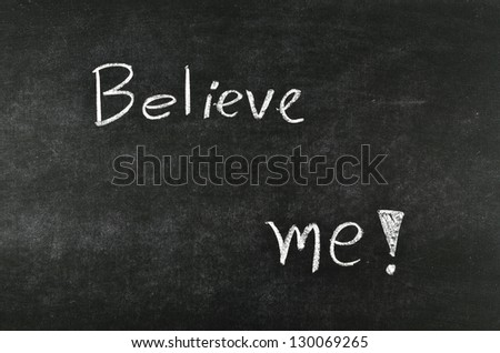 Believe me! written on a blackboard.