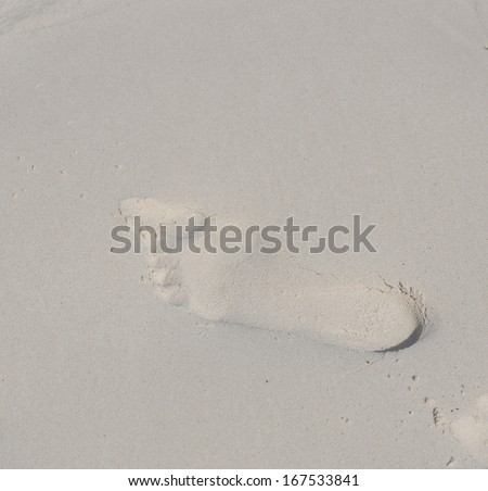 Human Footprints on the White Sand Beach in Tachai island.