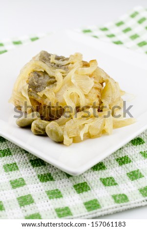 Codfish on plate with lima beans white background