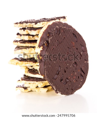A stack of chocolate coated rice cakes on white background