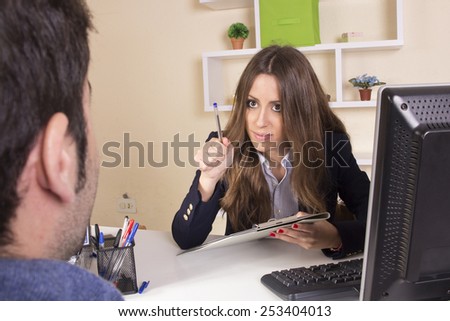 Business girl working in front of desktop at office