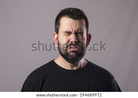Guy sneezing