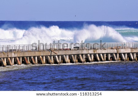 Waves on the pier in south Florida / Sandy\'s Surf