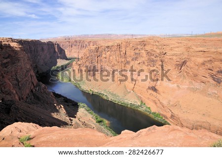 Standing on the edge overlooking the Colorado River near Page, Arizona / Colorado River Ledge