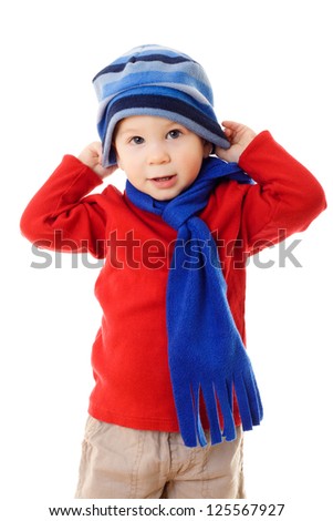 Little boy in winter clothes wearing the hat, isolated on white