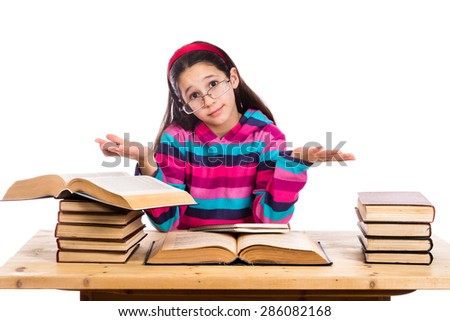 Confused girl with pile of old books showing ignorance, isolated on white