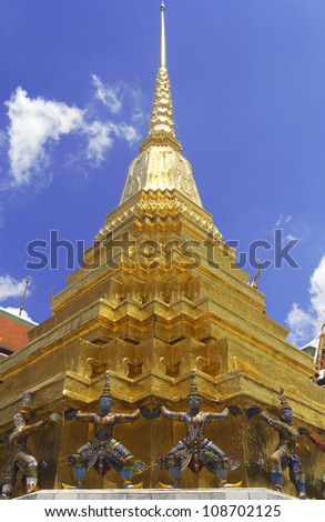 Golden Pagoda with Giant Statue at the base, Bangkok Grand Palace, Wat Phra Kaeo Bangkok Thailand