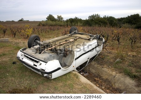 Car involved in a wreck turned upside down over a culvert. It looks like it made a perfect landing.
