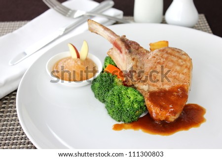 pork steaks with sauce and boiled vegetables