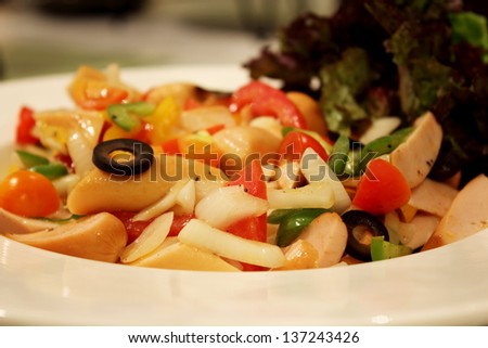 Thai fusion food sausage salad on white plat