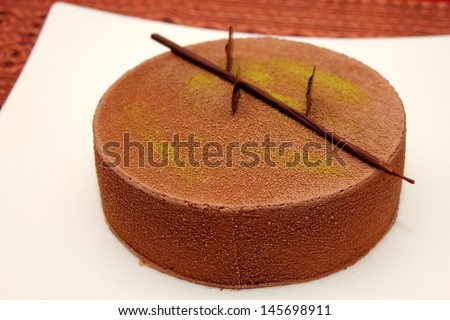 A Chocolate Mousse Cake on white plate