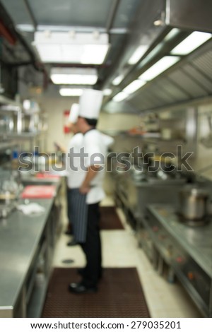 Industrial kitchen of a restaurant, hotel or hospital with busy cooks working.
