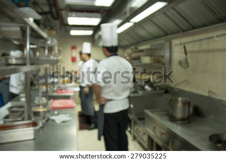 Industrial kitchen of a restaurant, hotel or hospital with busy cooks working.