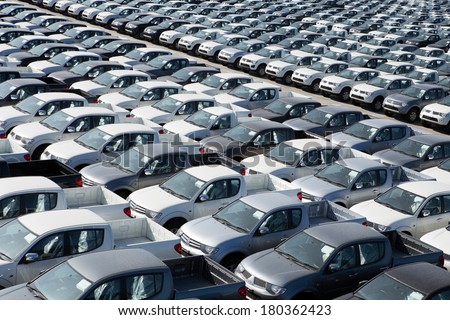 Motor vehicles in storage yard.