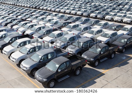 Motor vehicles in storage yard.