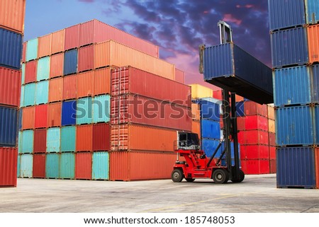 Crane lifter handling container box loading to truck in import export logustic zone