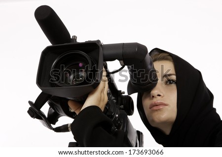 An Arab Student Looking Through A View Finder In A Filming Studio An Arab Student Looking Through A View Finder In A Filming Studio