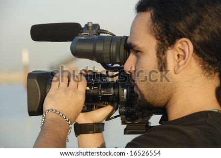 Cameraman Filming Outdoors