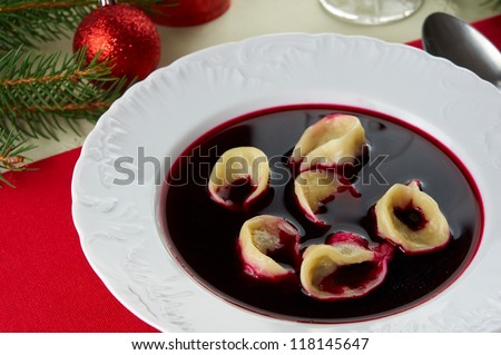Red borscht (Czerwony barsz) with mushroom dumplings. Traditional polish Christmas Eve dinner / supper.