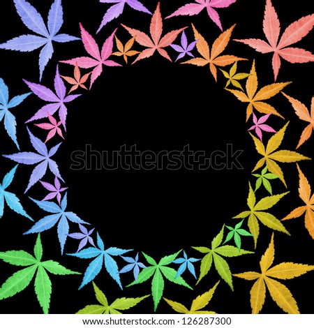 Circle frame of colorful leaves isolated on black. Leaves in rainbow colors. Copy space.