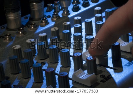 Professional audio mixing console with fades and adjusting knobs - radio / TV broadcasting