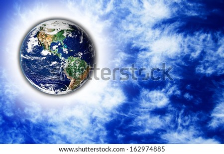 The Earth with light beam and sky in background,Elements of this image are furnished by NASA