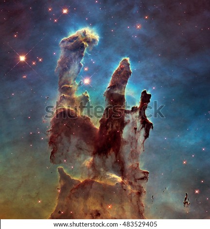 The Eagle Nebulaas Pillars of Creation. This image shows the pillars as seen in visible light, capturing the multi-coloured glow of gas clouds, Elements of this image are furnished by NASA.