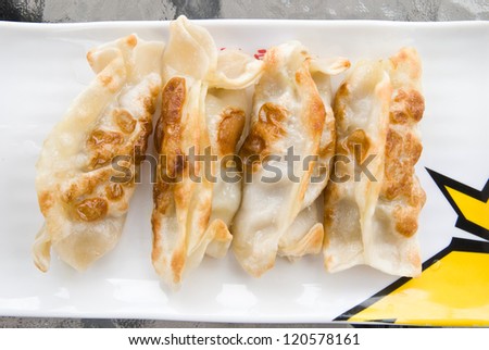 Fried Pot stickers, Dumplings, Traditional Asian Food, Stuffed with Pork Meat or Vegetables