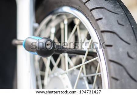 Security lock blocking the motorcycle wheel