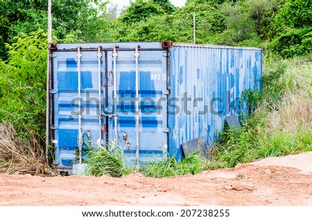 big blue old storage trailers with locks on them